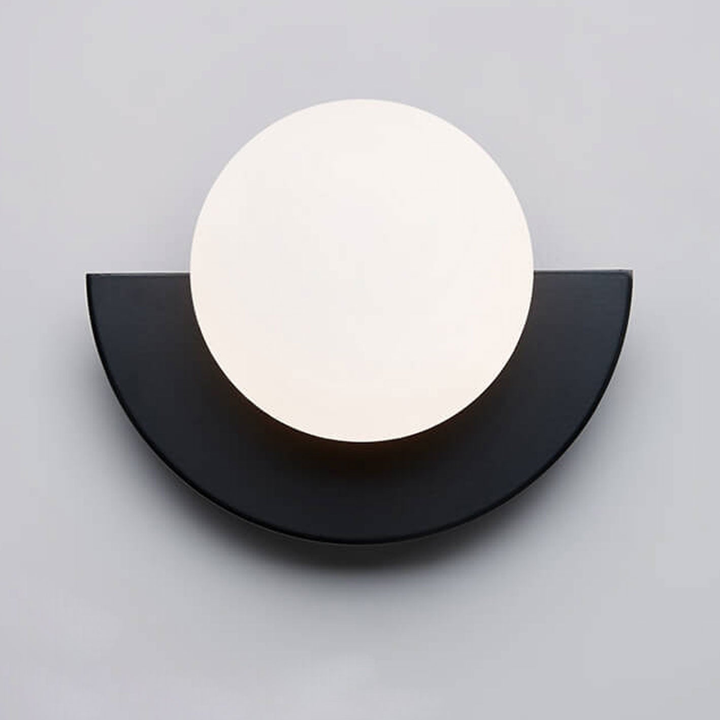 Colorful glass sphere wall sconce mounted in modern living room