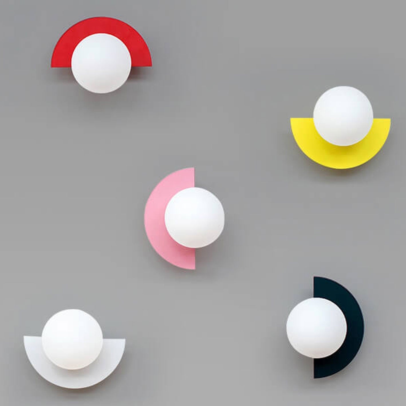 Pink glass sphere wall sconce, modern minimalist design