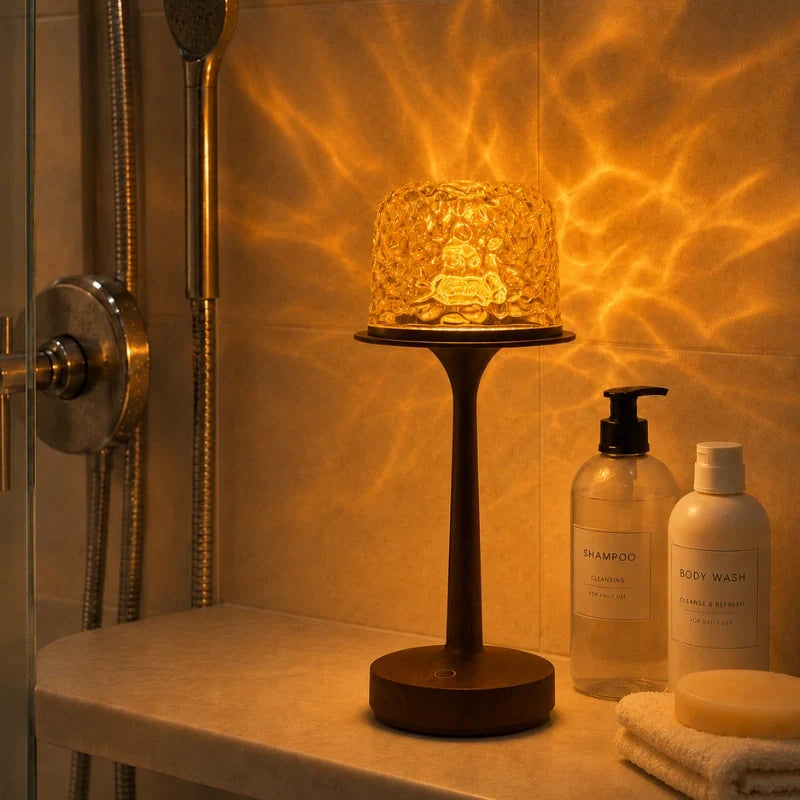 Arvika projector top glowing amber on a shower ledge