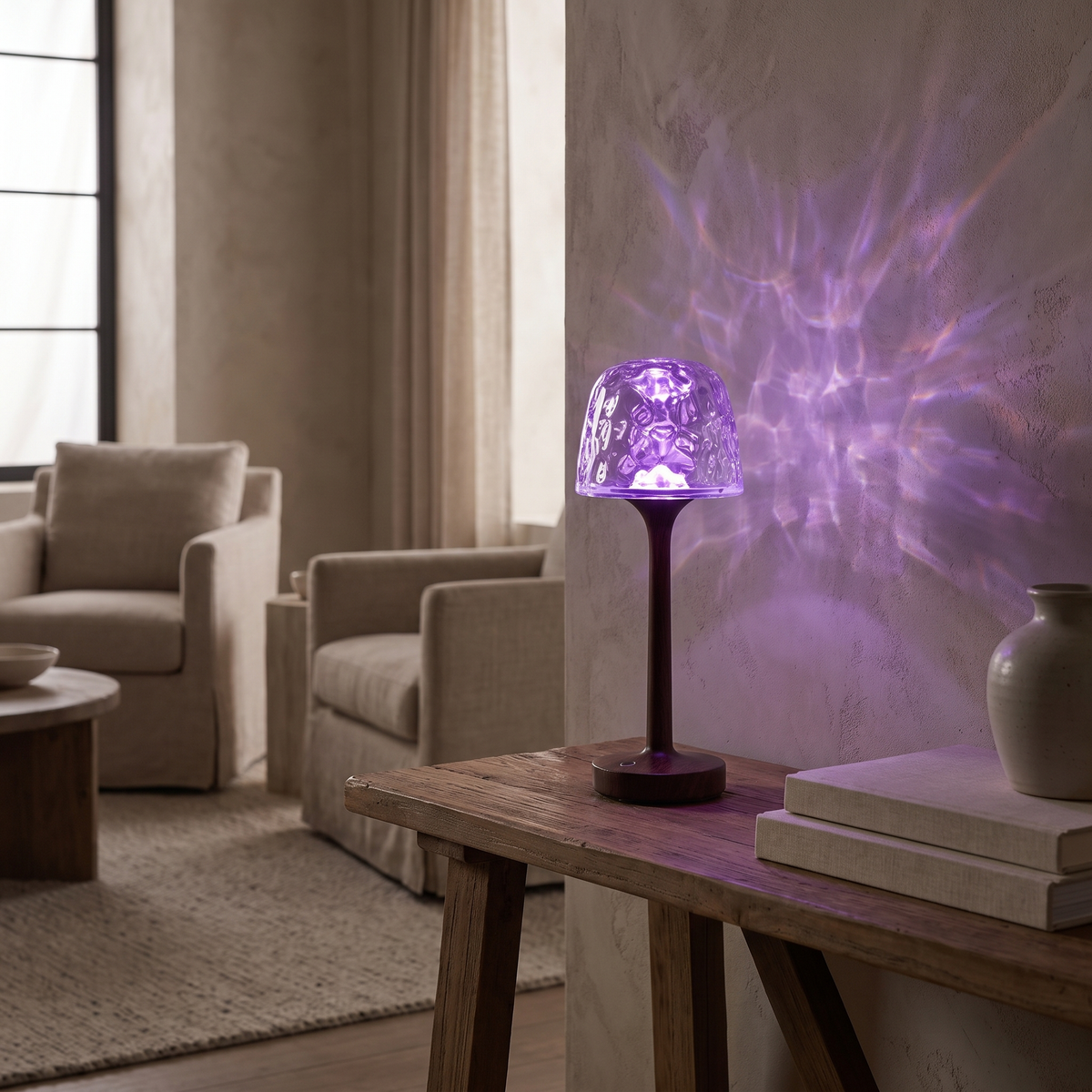 Arvika crystal top casting violet light on a living room wall