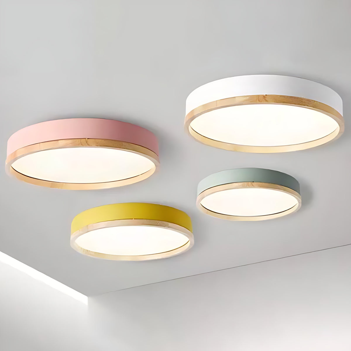 Eila round ceiling lights in pink, white, yellow and green on one ceiling