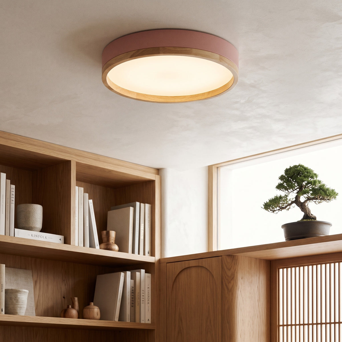 Pink Eila round ceiling light above wooden shelves