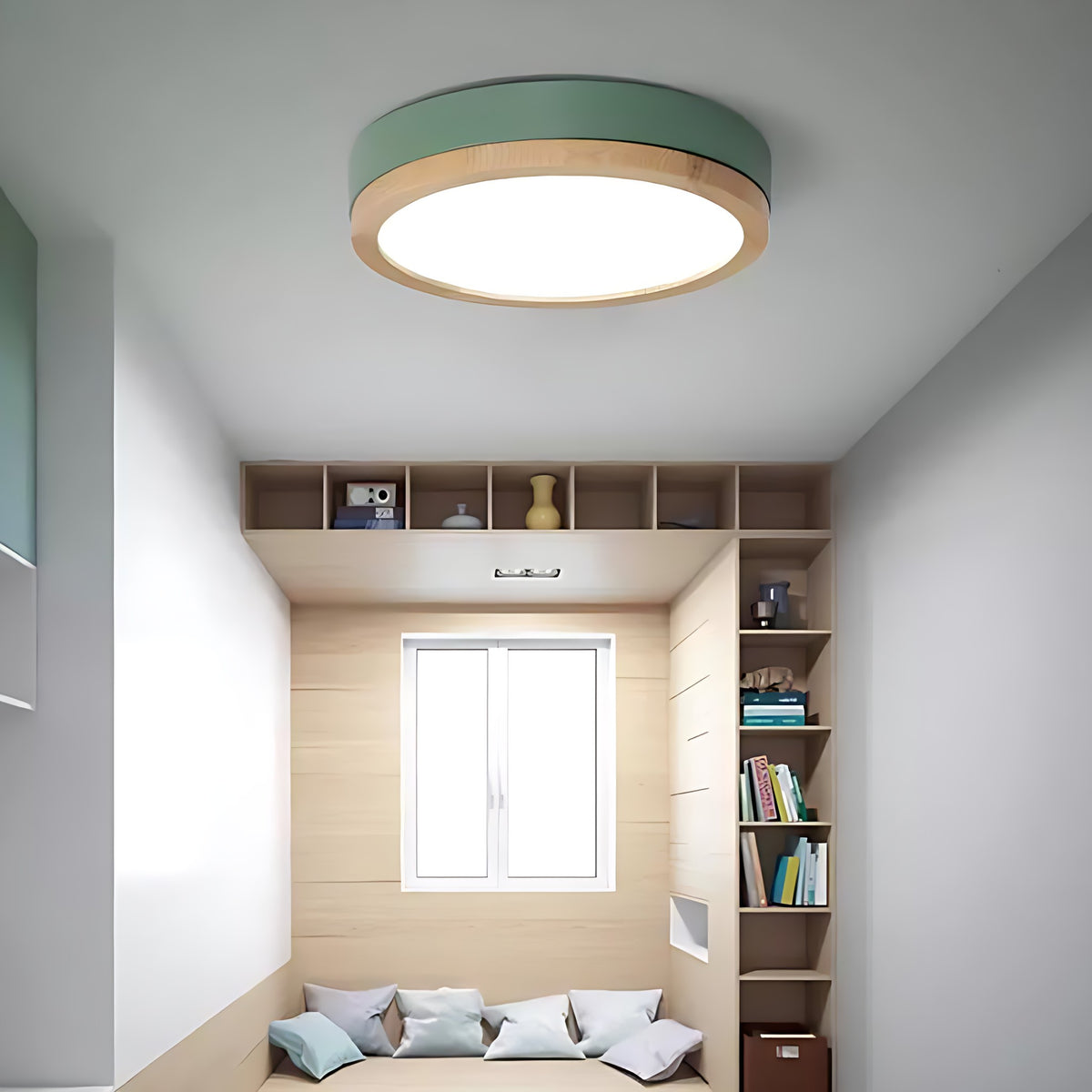 Green Eila round ceiling light in a small reading room with shelves