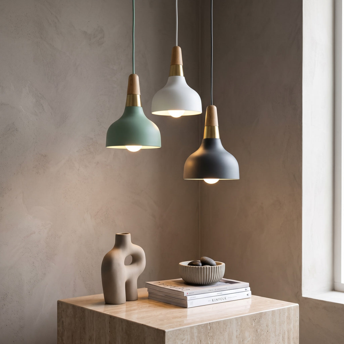 Green, white and gray Eira pendant lights hanging in a corner