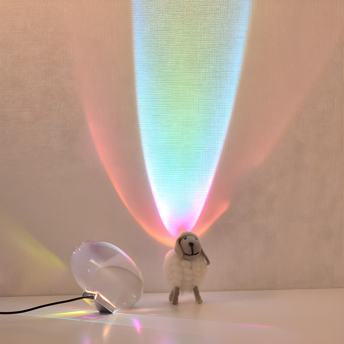 Elna projection lamp sending a beam of colored light up the wall