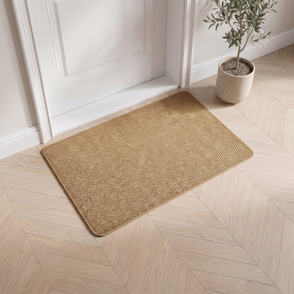 Faux jute door mat in natural lying inside a white front door