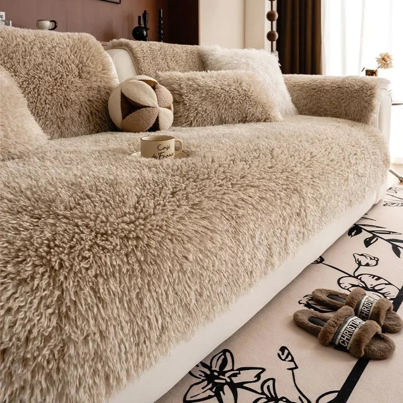Beige faux lambswool sofa cover on a sofa