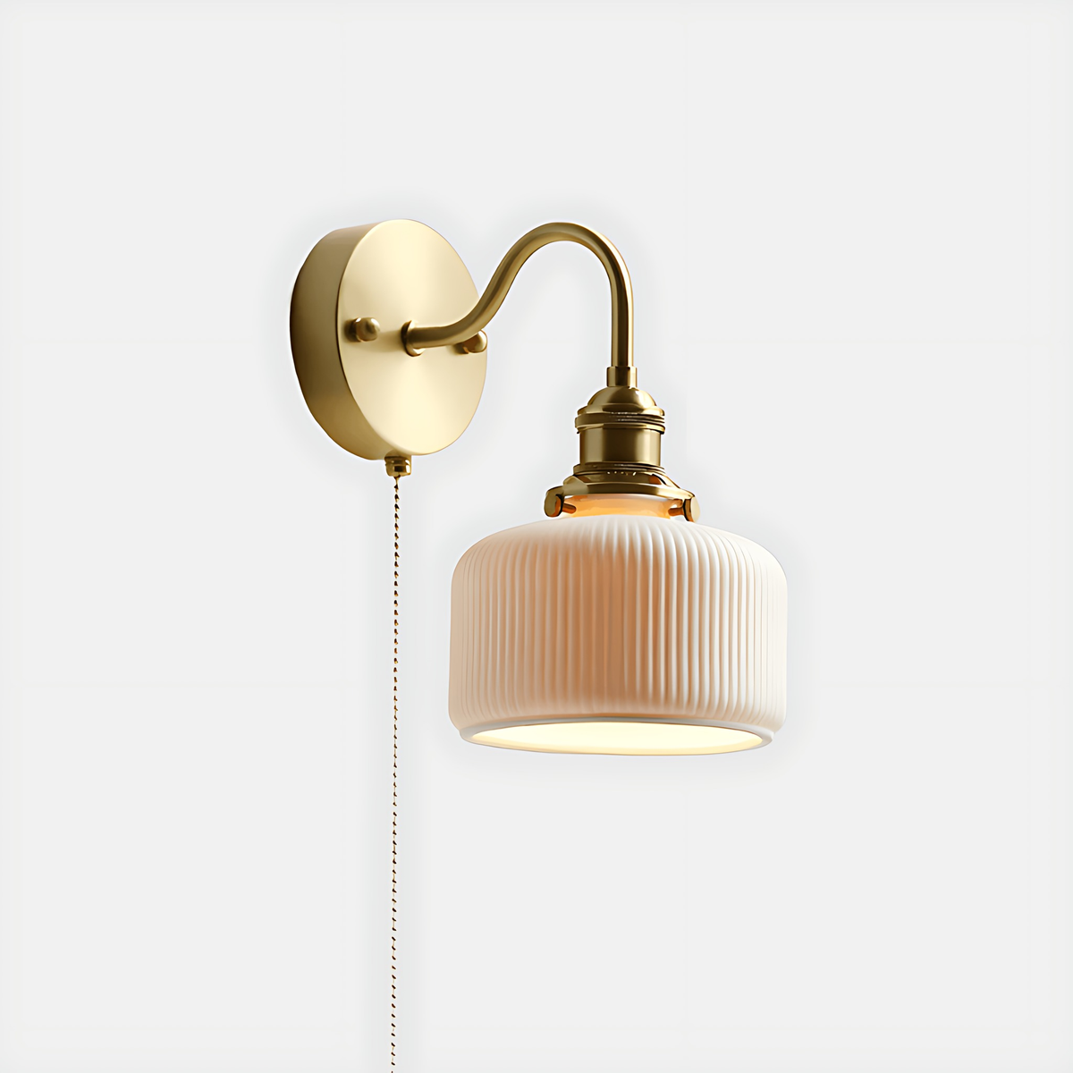 Fia wall sconce with a curved arm on a light gray background