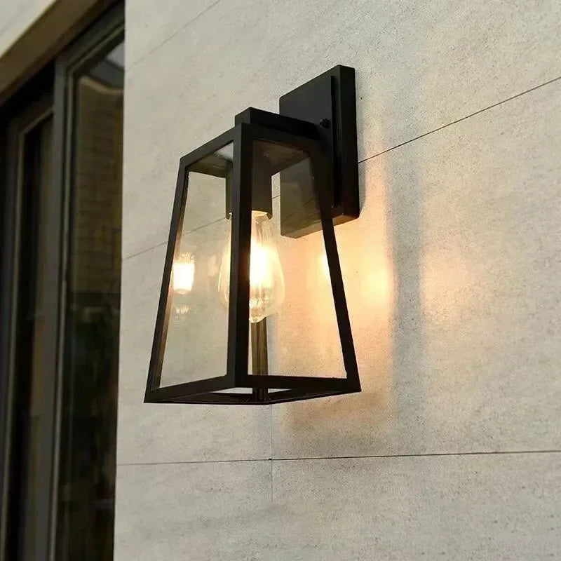 Fjell outdoor wall lantern lit on a pale stone wall
