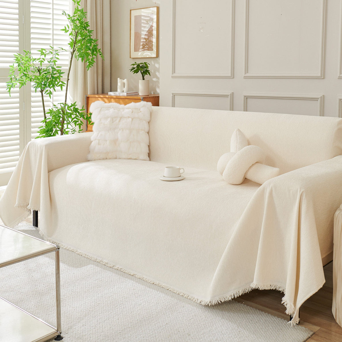 Cream woven sofa cover over a sofa