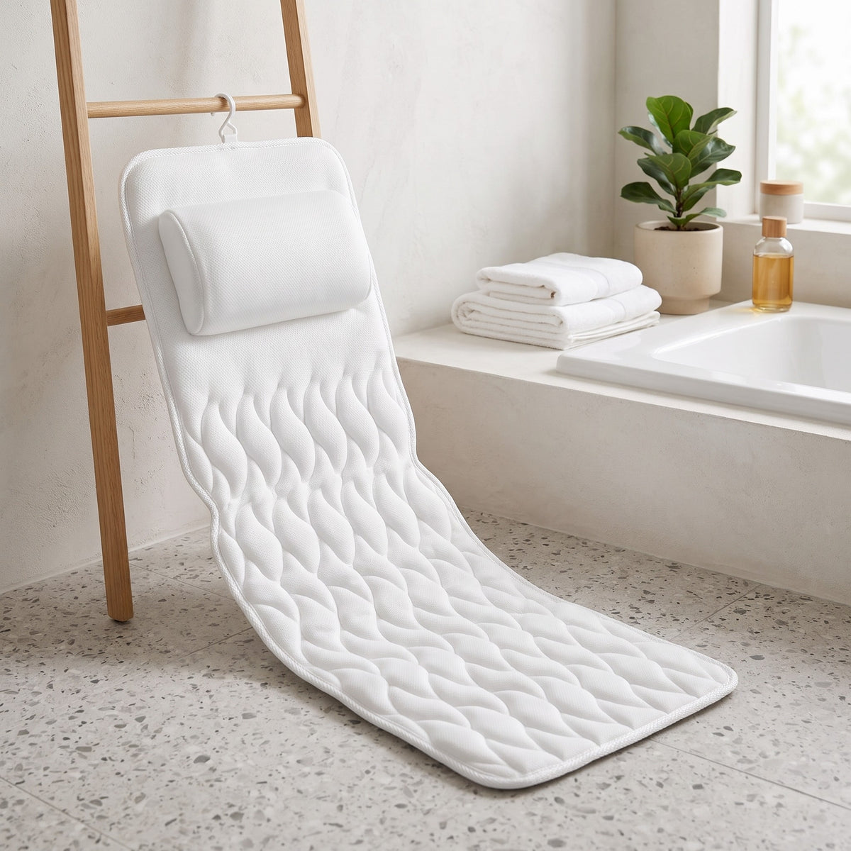 Full body bath pillow hanging to dry on a ladder by its hook