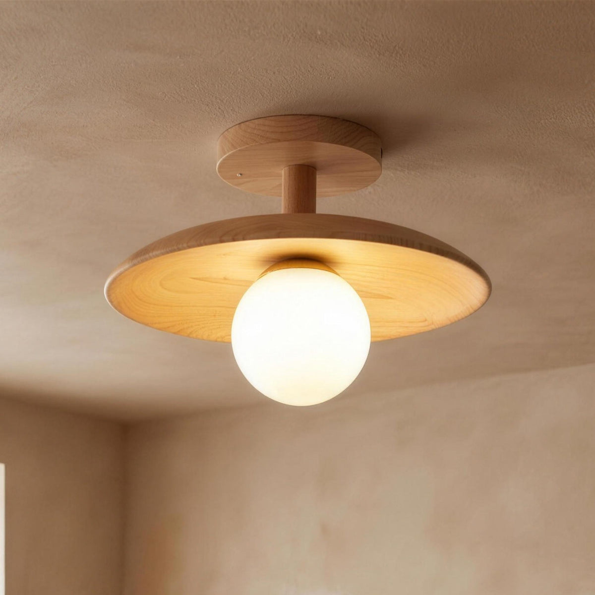 Gerda semi flush ceiling light, wood disc over a frosted glass globe, lit