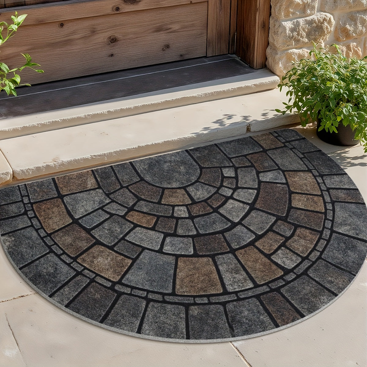 Half round mosaic door mat outside a wood door with plants