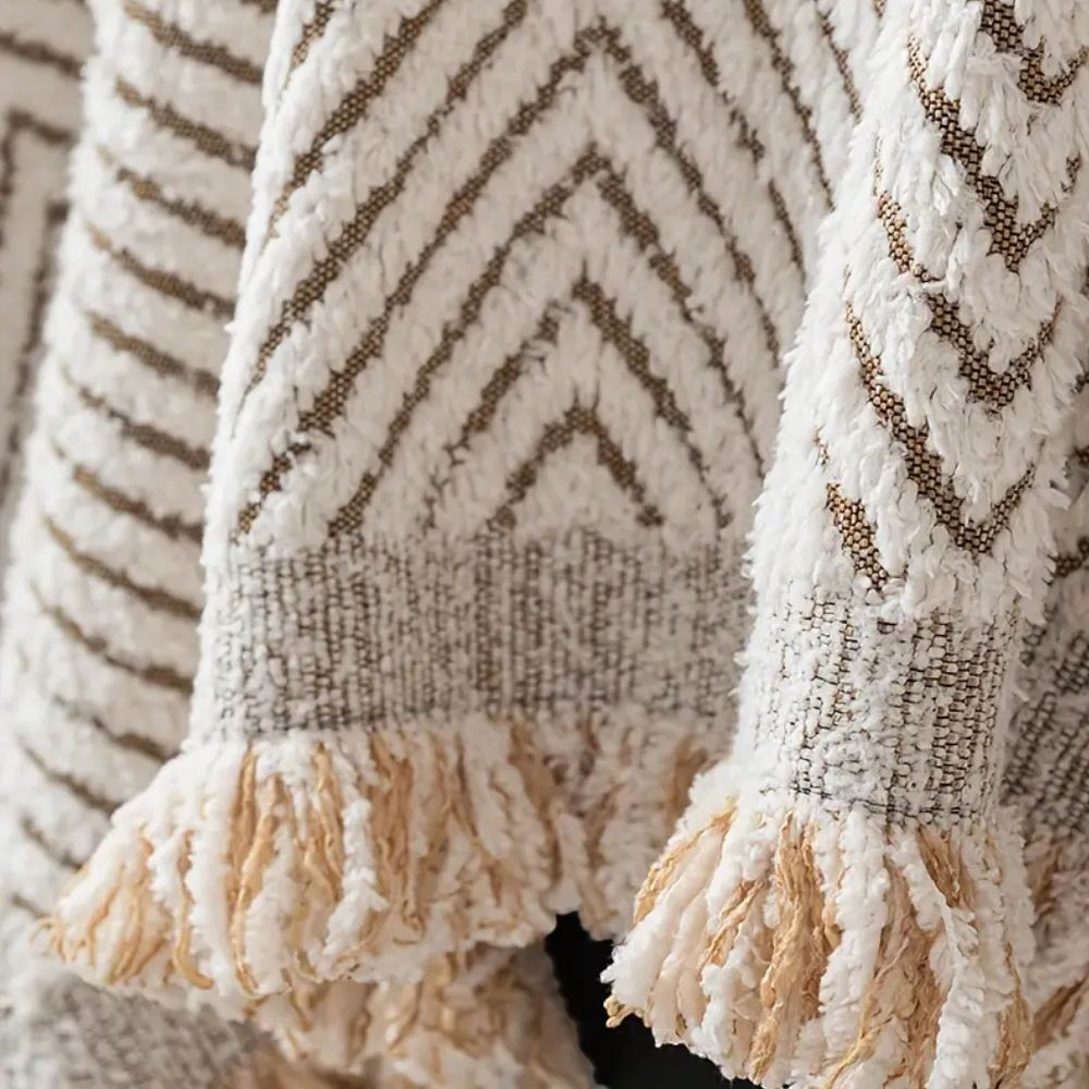 Close view of the herringbone pile and the tasseled edge