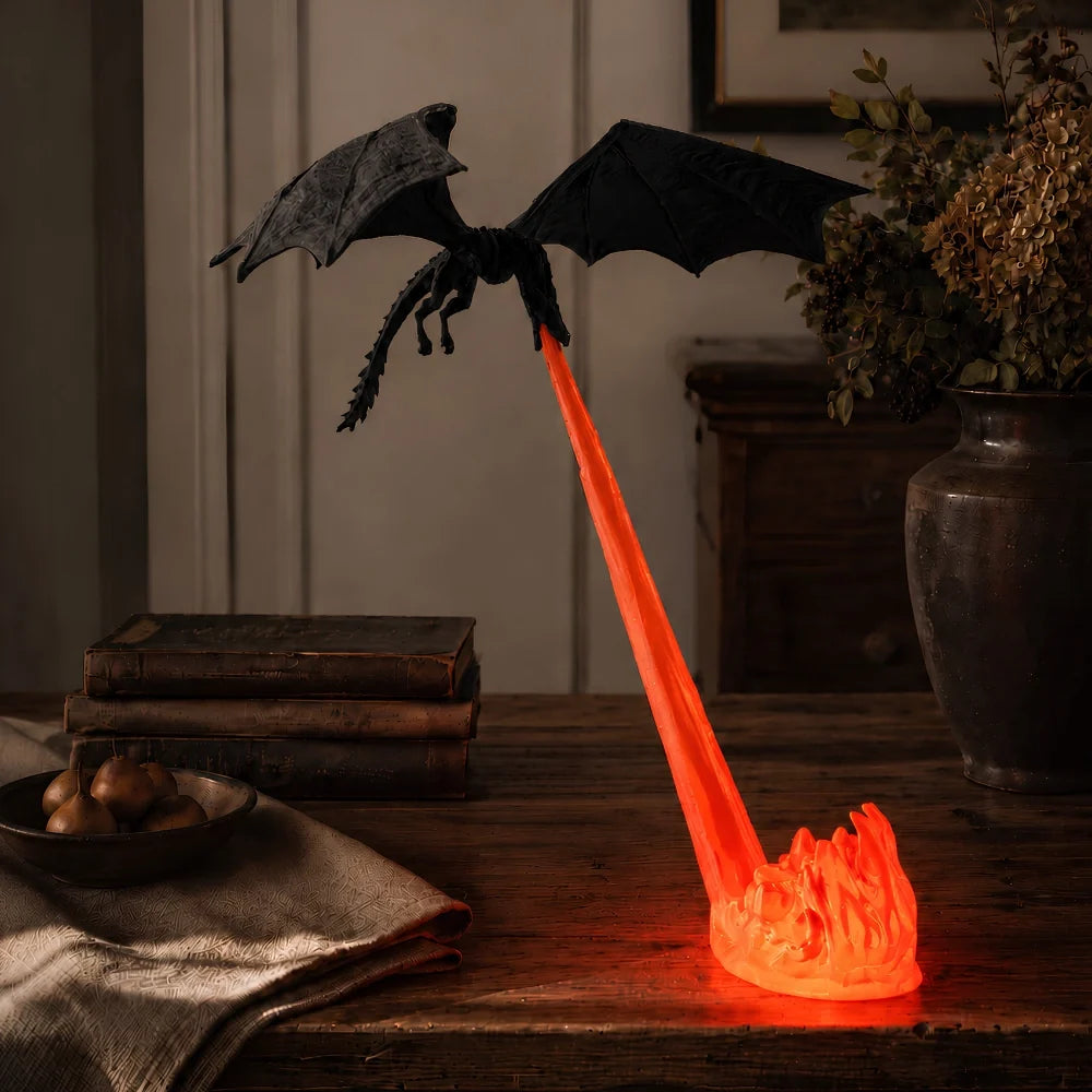 Holte dragon night light glowing on a wood side table