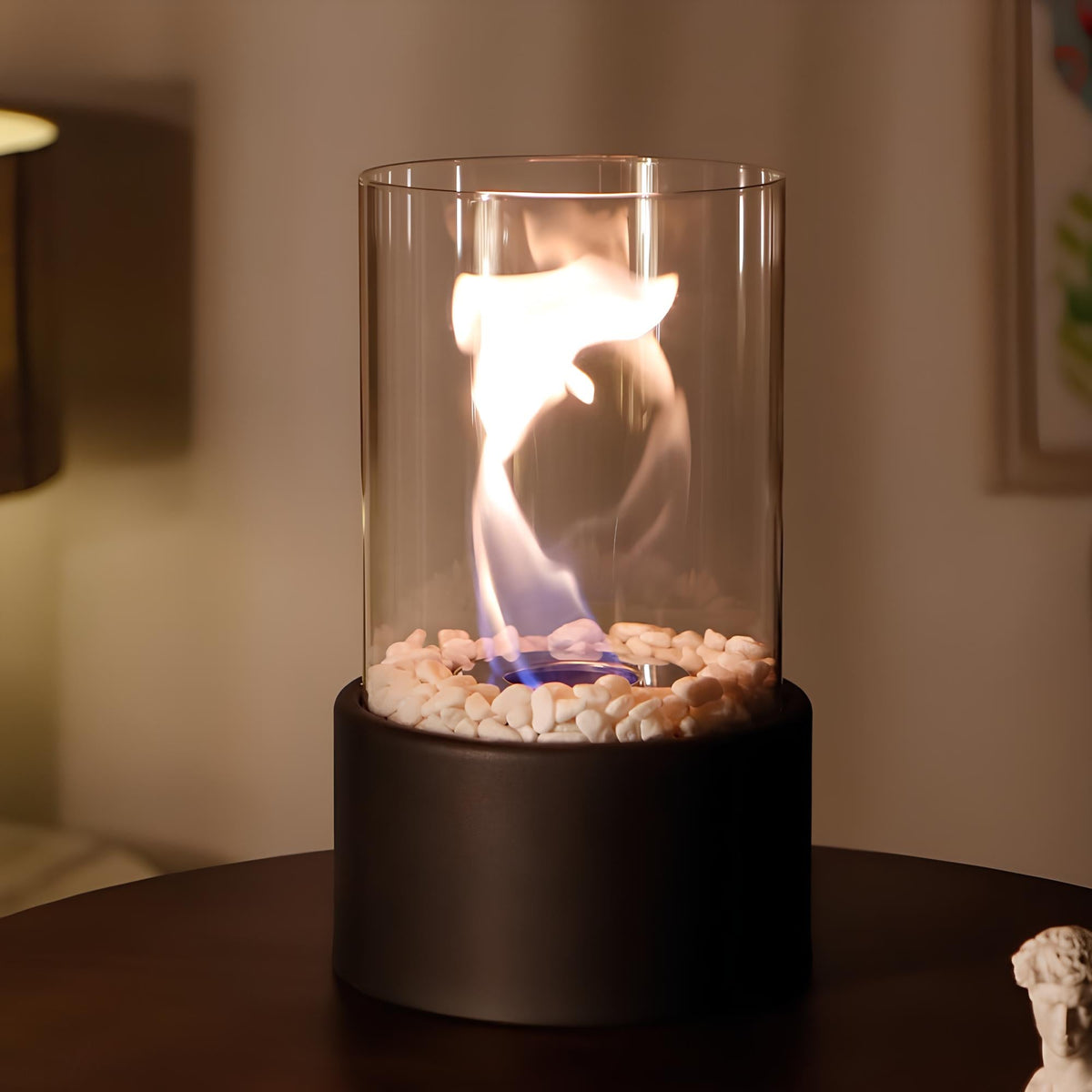 Horten fire lamp in black with the flame inside the glass cylinder