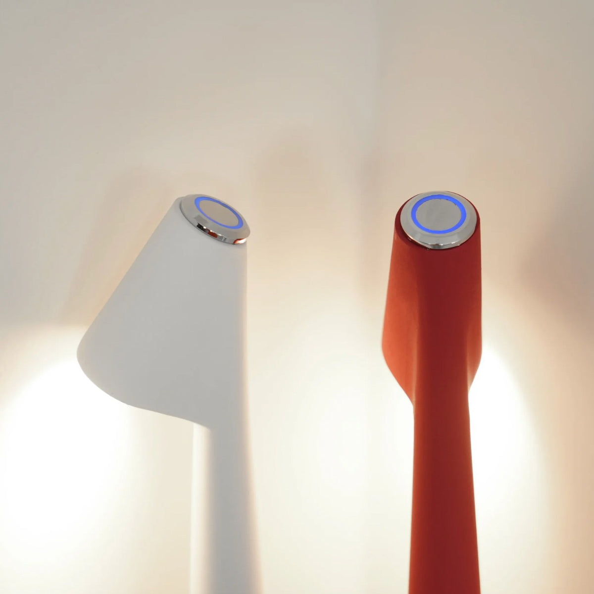 Close view of two Iben lamp heads with the ring of light at the touch point