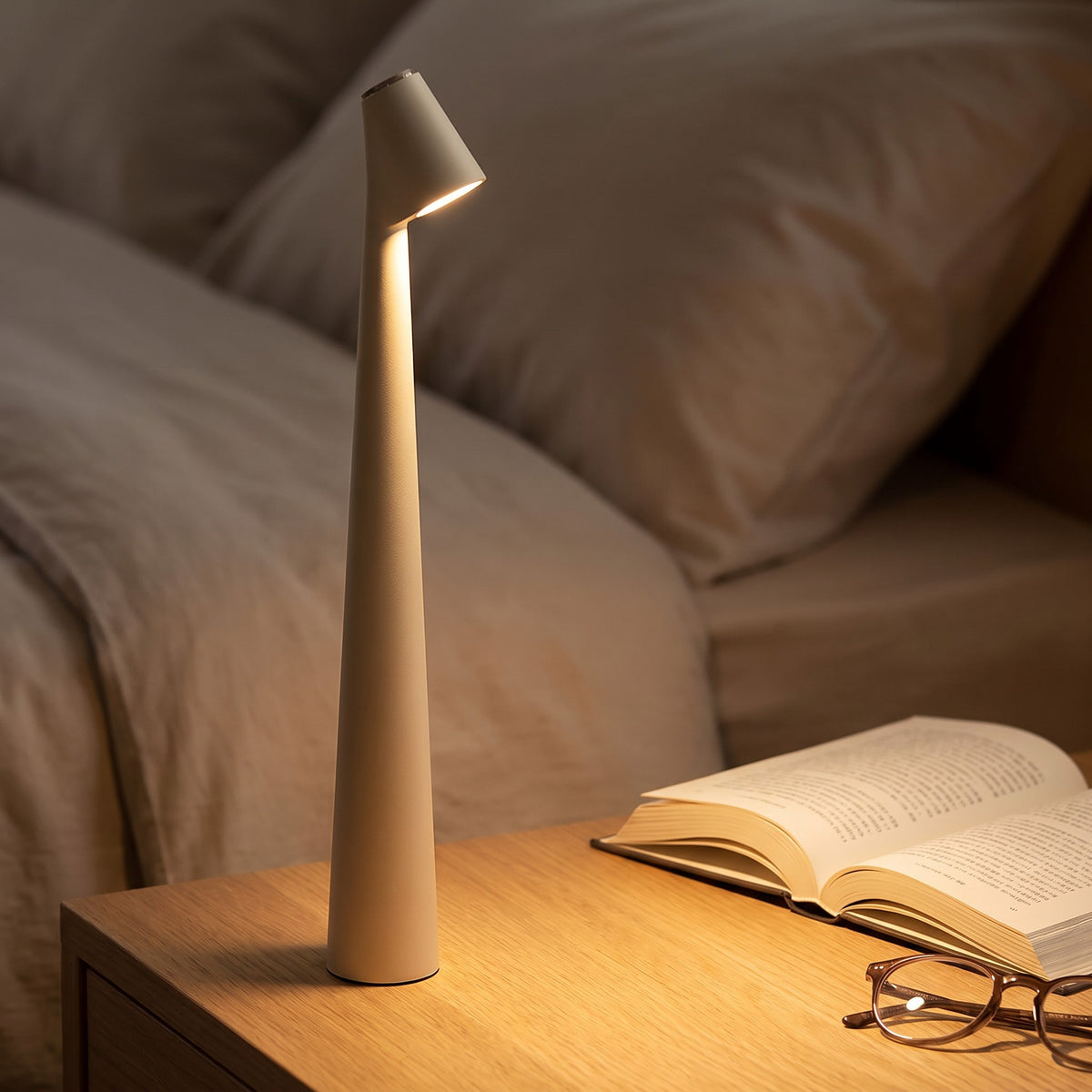 Iben table lamp in white on a bedside table, close view