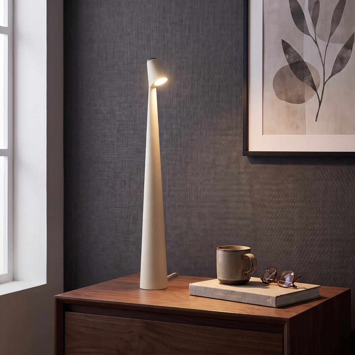 Iben table lamp in White on a nightstand beside a window