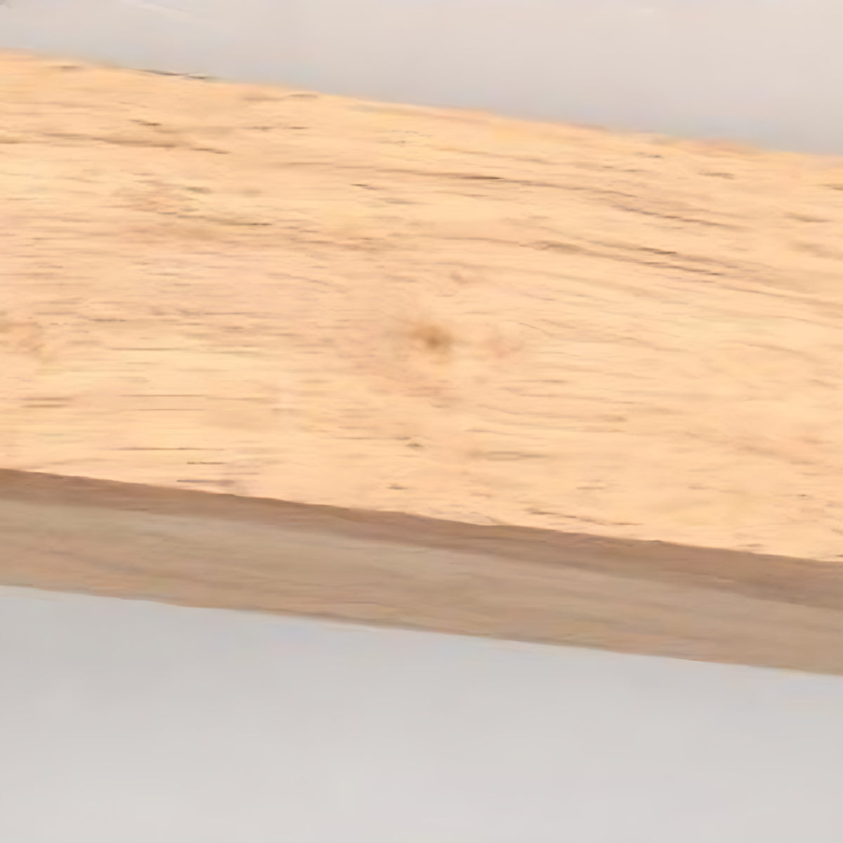 Close view of the rubberwood grain on the Iida light