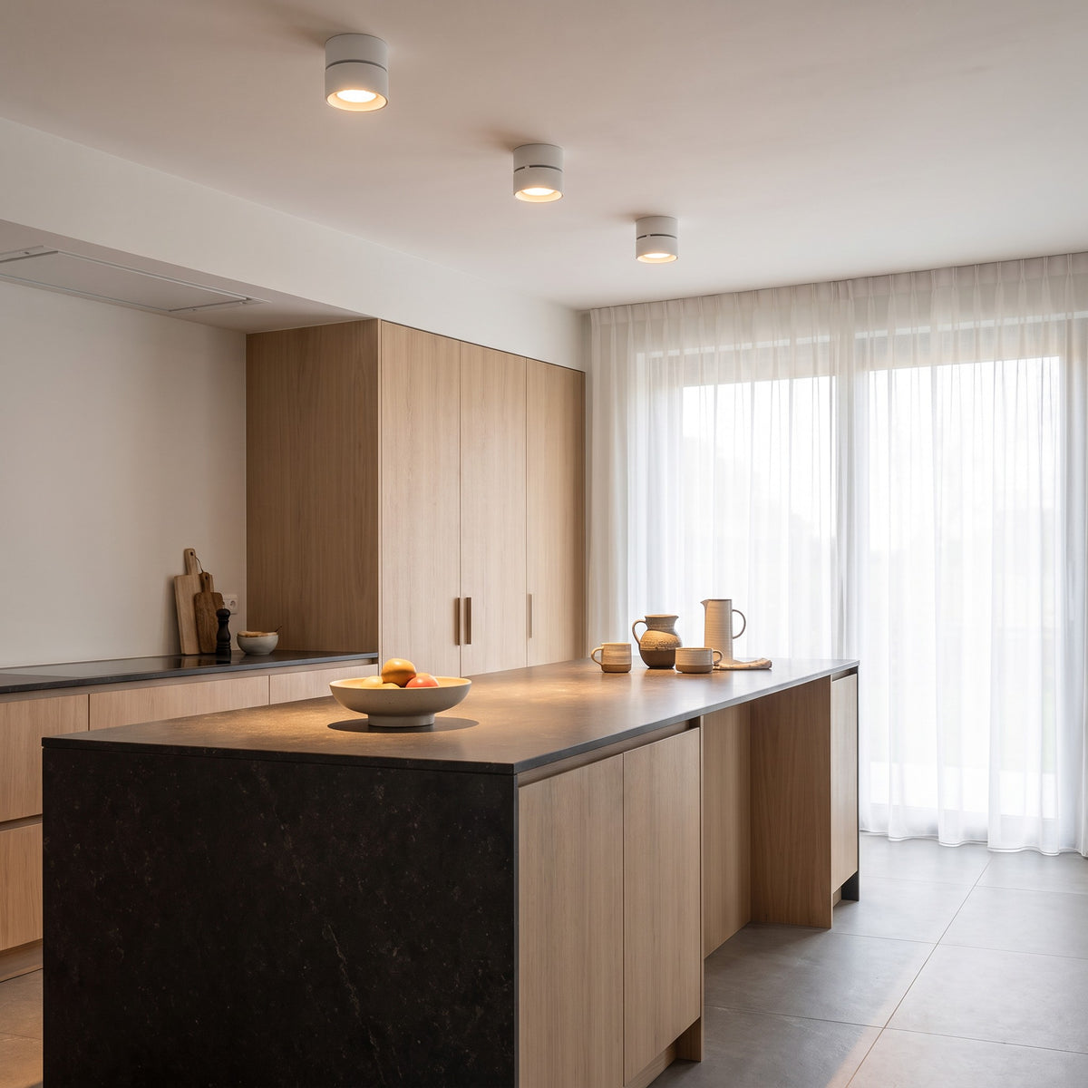 Ilse LED ceiling spotlights lit over a kitchen island