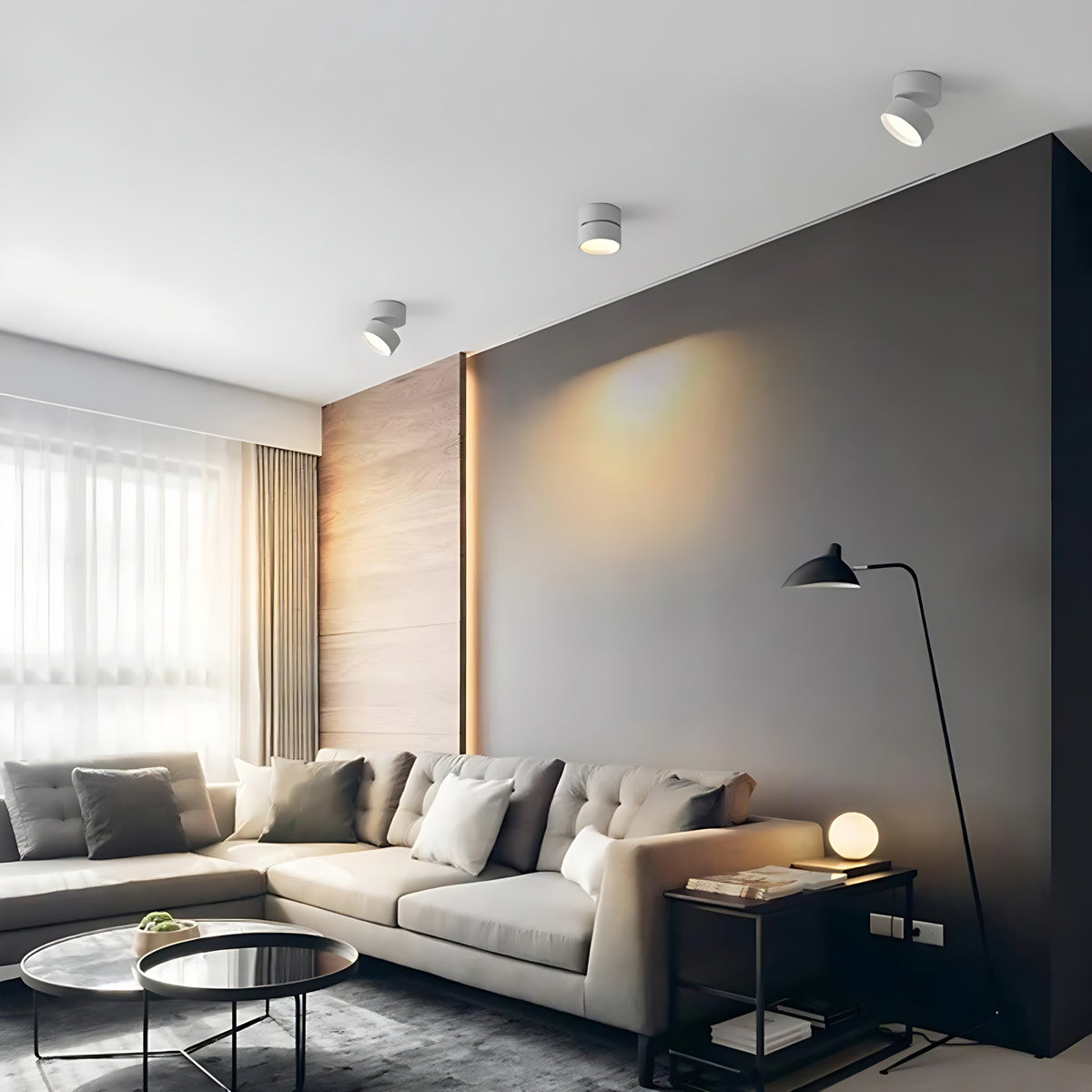 Ilse LED ceiling spotlights in a living room with a gray sectional