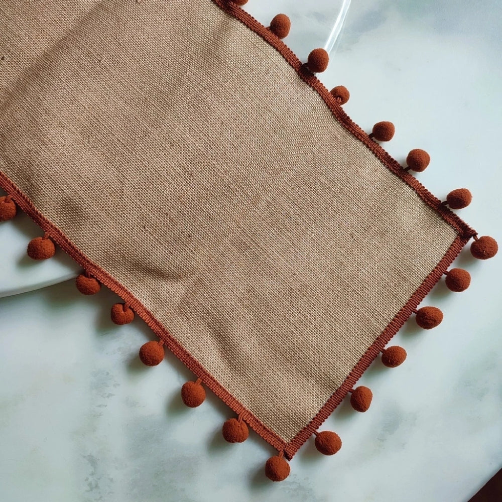 Close view of the jute weave and pom poms