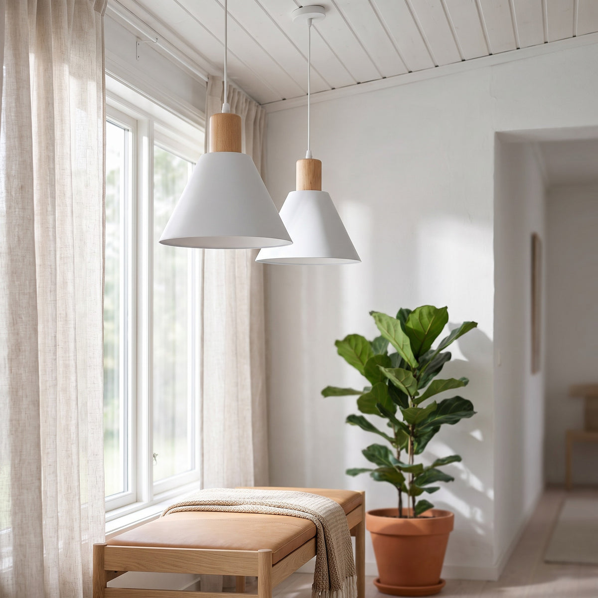 Two white Kirsten pendant lights in a bright entry with a bench by the window