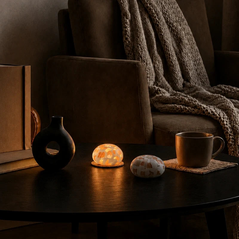 Kvist dome lights on a dark coffee table