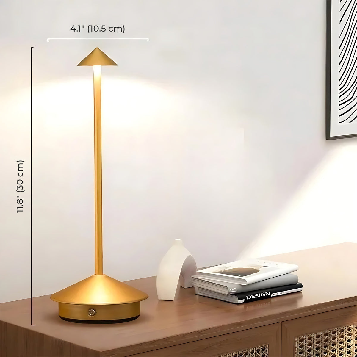 Gold Lene cordless table lamp lit on a sideboard