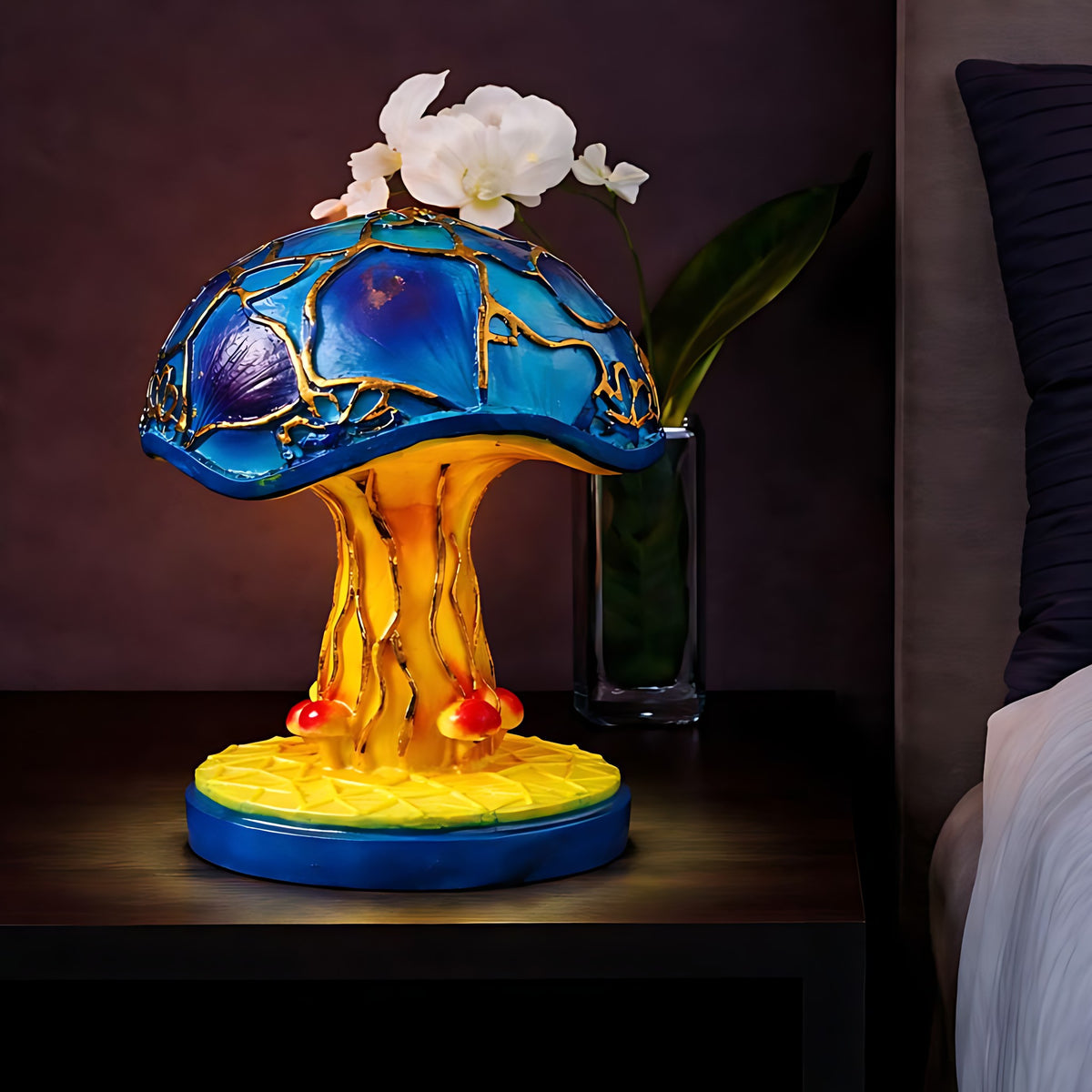 Big Foot Majken mushroom table lamp lit on a nightstand
