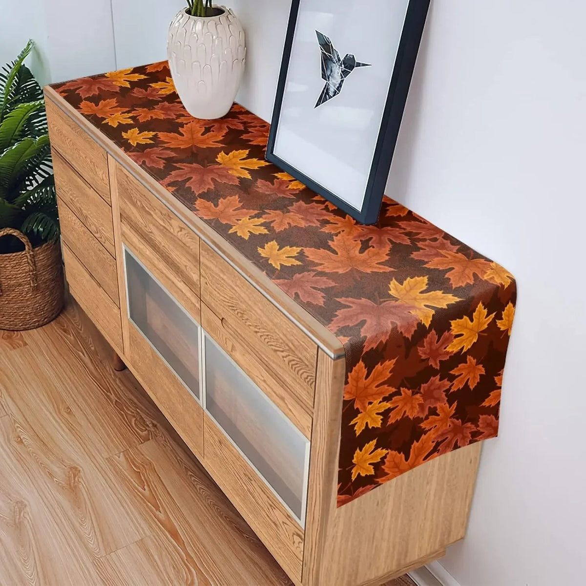 Maple leaf print runner on a wood sideboard