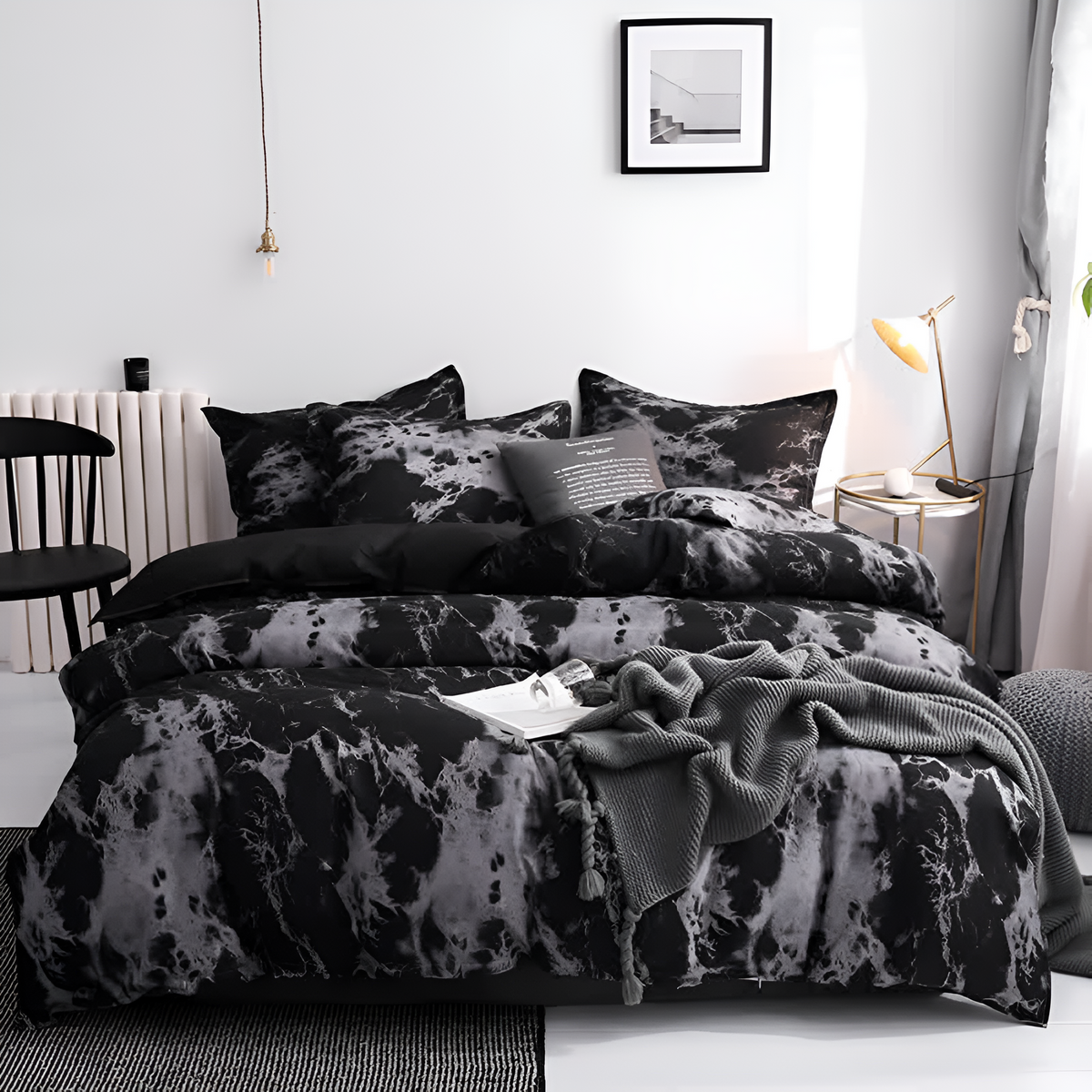 Black marble duvet cover set on a bed in a white bedroom