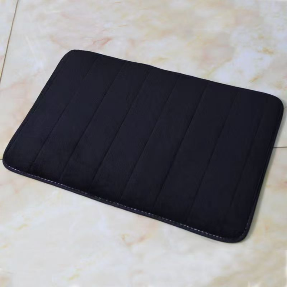 Dark blue microfiber bath mat on a marble look floor