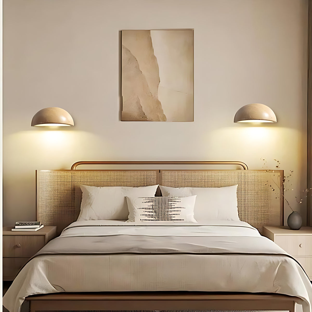 Two Mira LED wall sconces lit above a bed