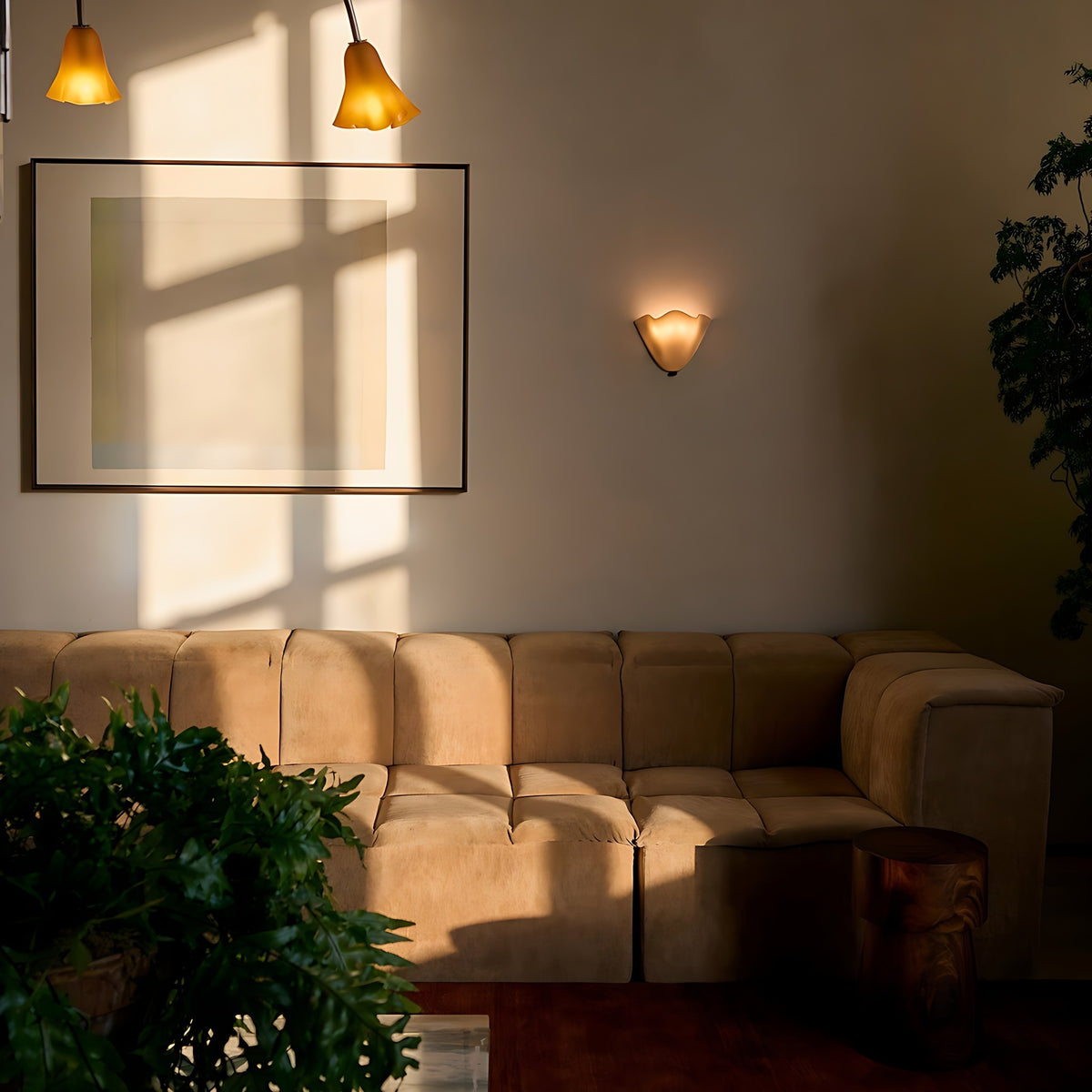 Moa wall sconce lit in a living room