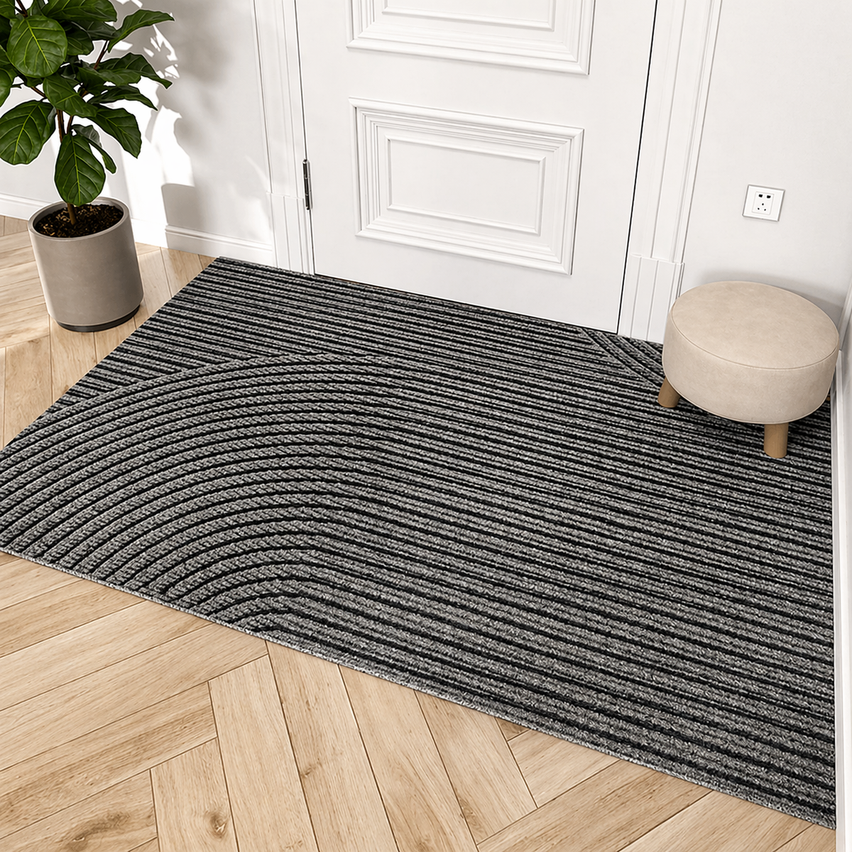 Gray door mat inside a white front door on a wood floor
