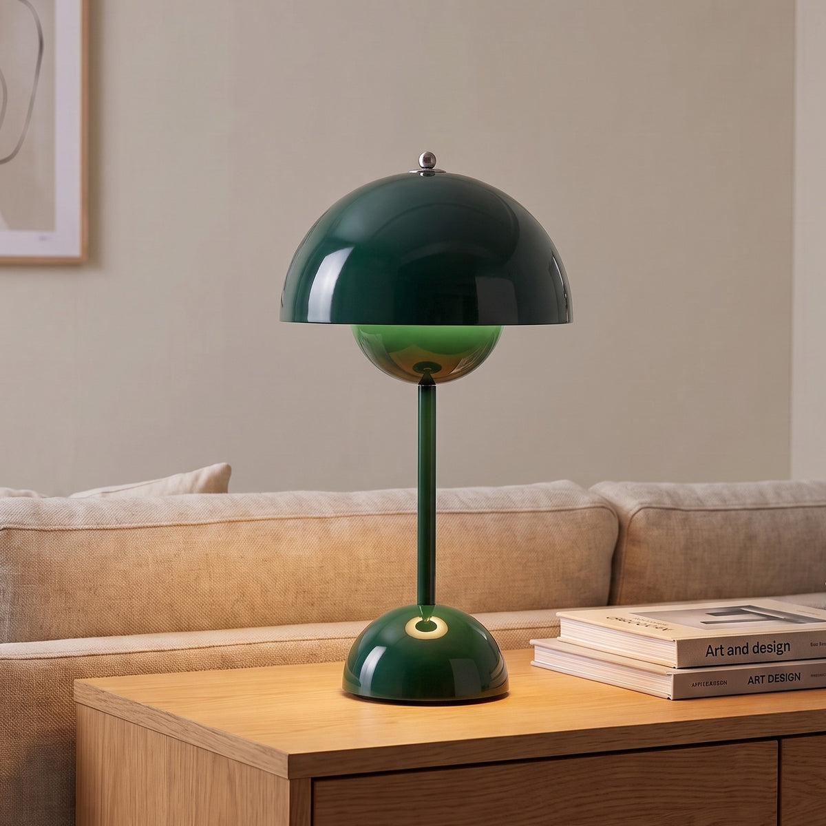 Oona table lamp in Dark Green on a sideboard beside a sofa