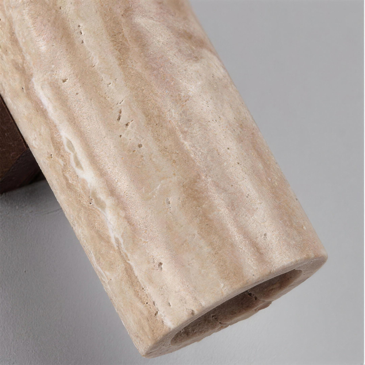 Close up of the travertine surface with its small pores and soft veins