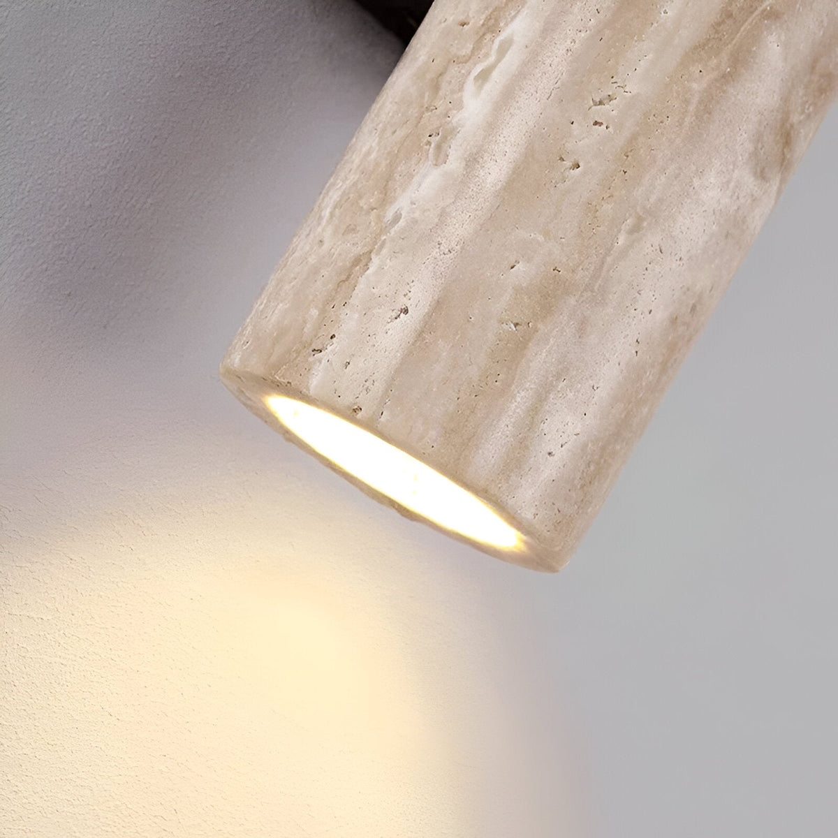 Close up of the lit lower opening of the travertine cylinder