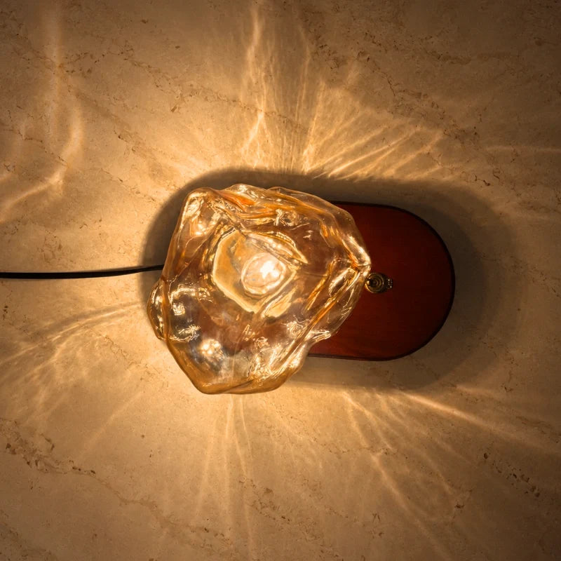 Top view of the Ribe lamp showing the amber glass and oak base