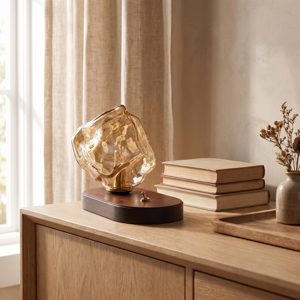 Ribe amber glass shade on its oak base on an oak sideboard