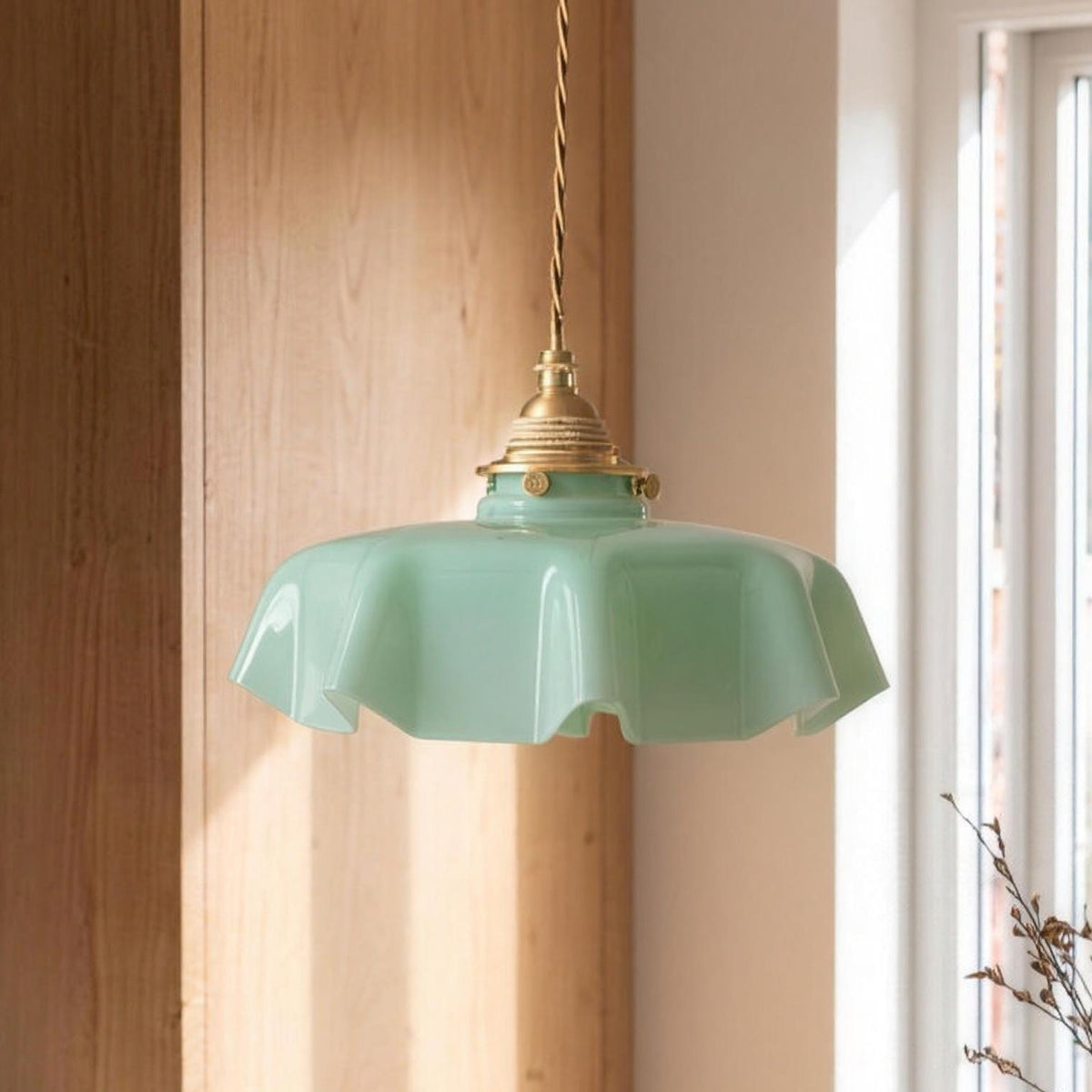 Ronja pendant light in green glass over a kitchen table