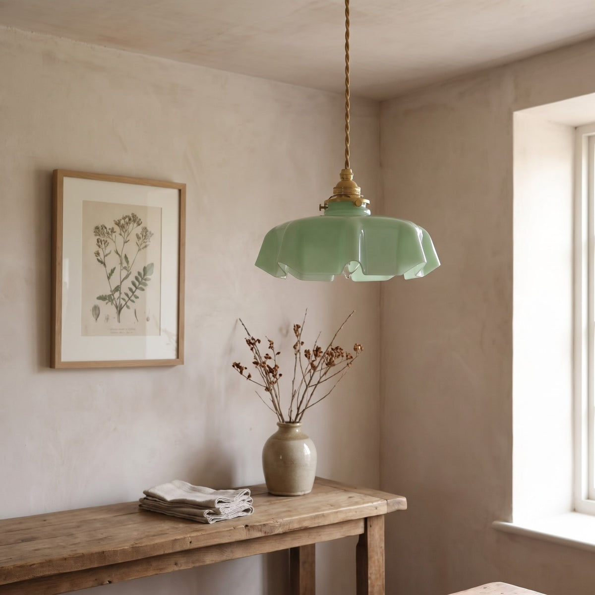 Ronja pendant light in green glass over a rustic console