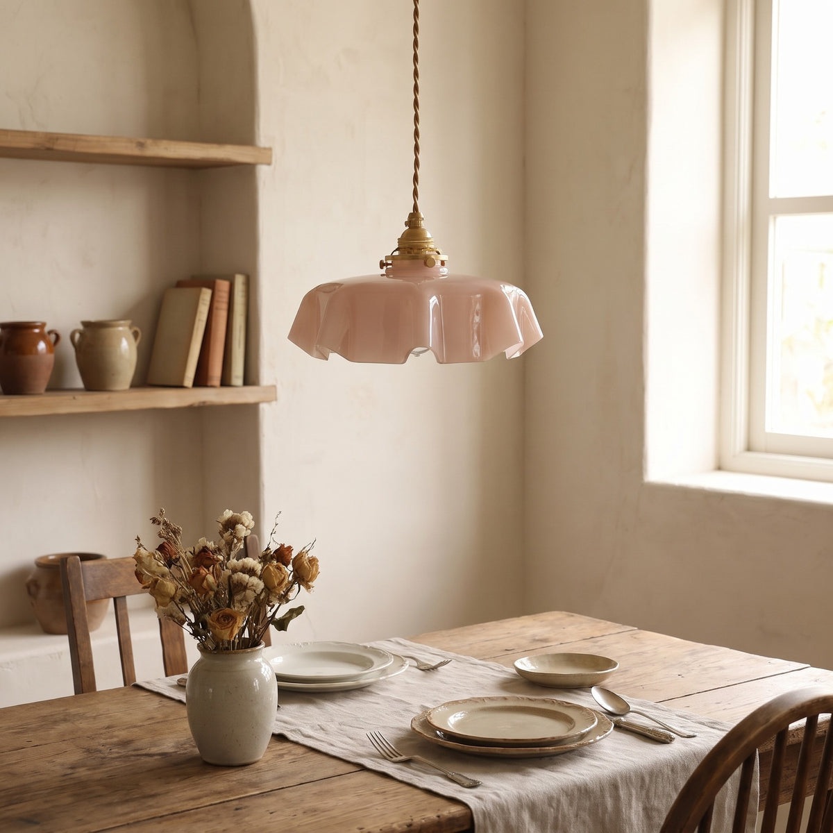 Ronja pendant light in rose glass over a set dining table