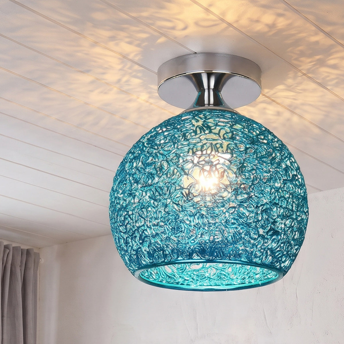Blue Saara wire dome ceiling light lit in the same room