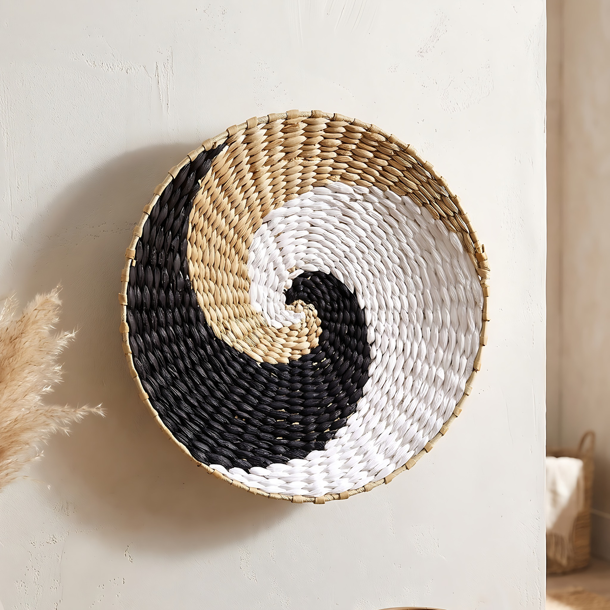 Sanne seagrass wall basket in Black and White Wave, 13.8", on a warm white limewash wall
