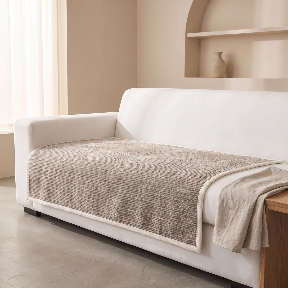 Ribbed sofa cover smoothed over a sofa seat