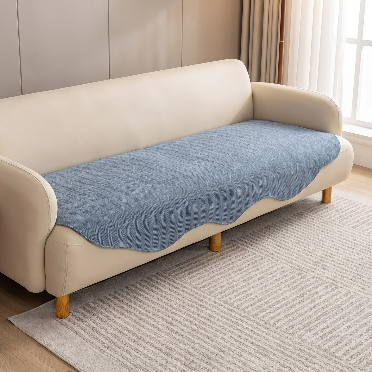 Sofa Seat Cover in Blue on a sofa in a living room