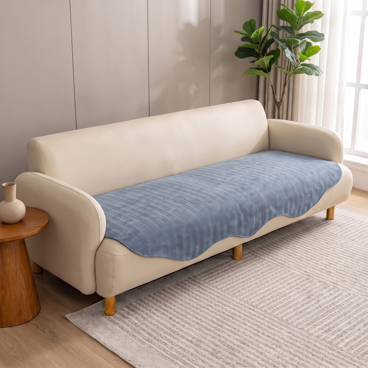 Sofa Seat Cover in Blue on a sofa in a lived in room